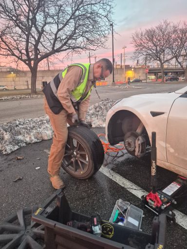 Tesla tire repair / Tire Change in jersey city Roadside assistance in Jersey City NJ fixing flat tire and helping driver