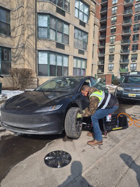 24/7 Roadside assistance in Weehawken NJ performing a tire change Happy road services performing a Tire Change / Tire Repair In Weehawken NJ , Also Serving Entire Hudson county