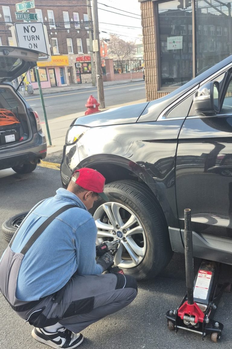 Happy road services in Bayonne NJ Doing a tire change tire change in Bayonne NJ, 53 st.