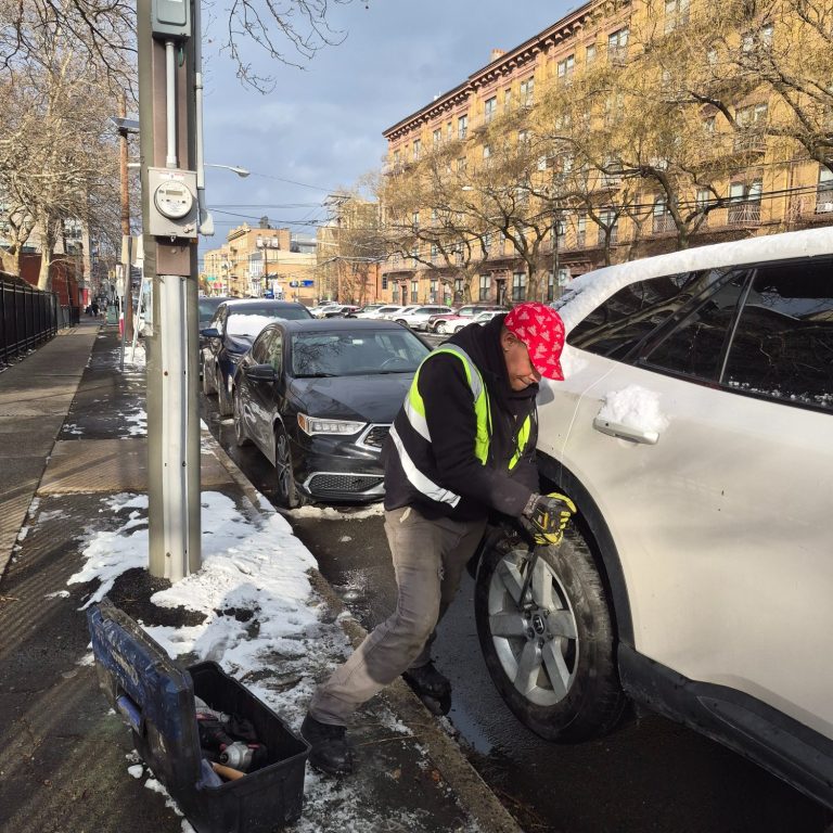 Mobile Tire Change Service in Hoboken NJ Technician from Happy Road Services performing a mobile tire change in Hoboken NJ