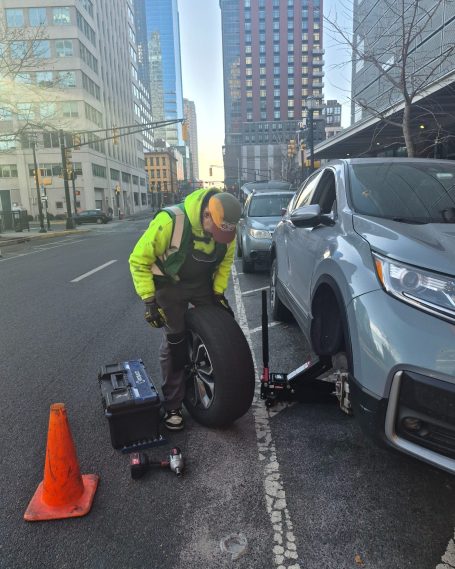 Roadside Tire Repair Service roadside tire repair service fixing punctured tire